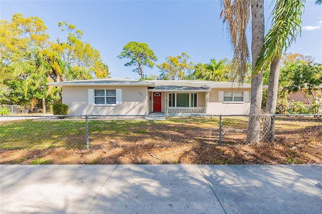 777 27th Ave S, Saint Petersburg, FL 33705 - ranch-style house with a fenced front yard and stucco siding