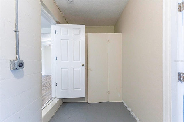 corridor featuring tile patterned flooring