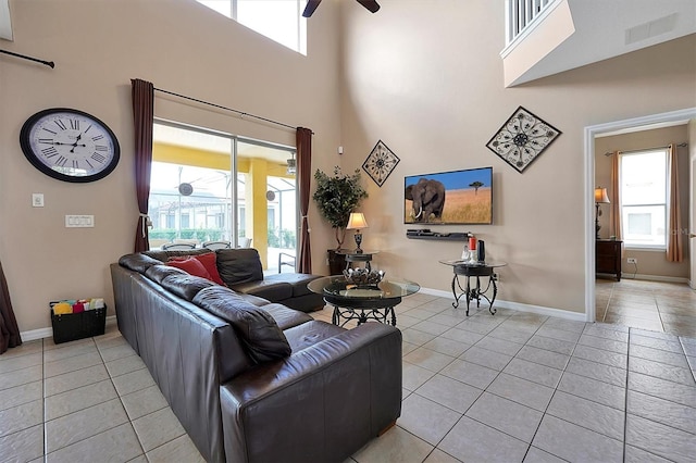 living area with visible vents, plenty of natural light, and light tile patterned floors