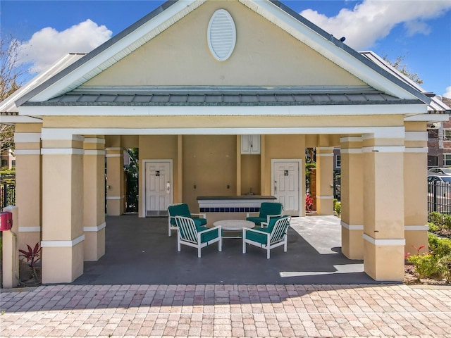 rear view of property with stucco siding