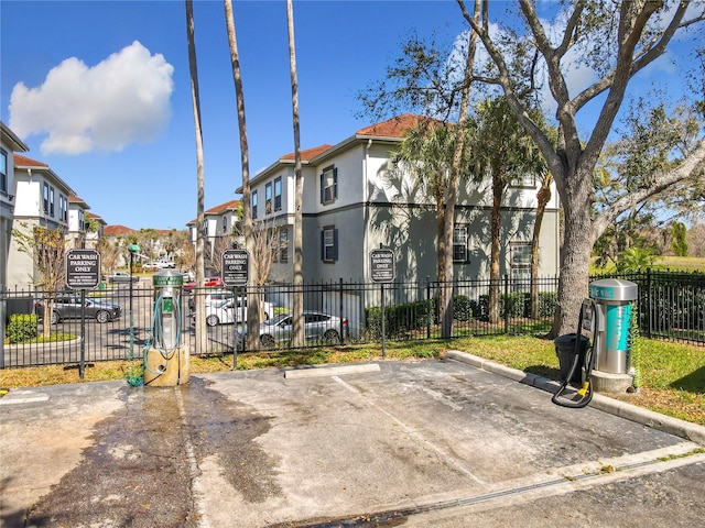 exterior space with a residential view and fence