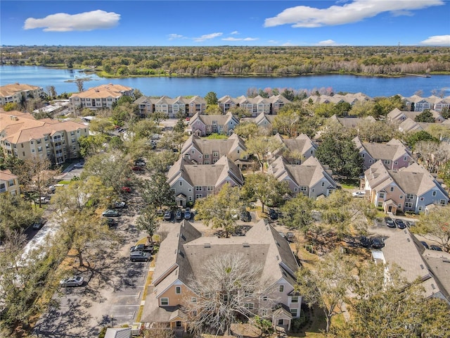 birds eye view of property with a residential view and a water view