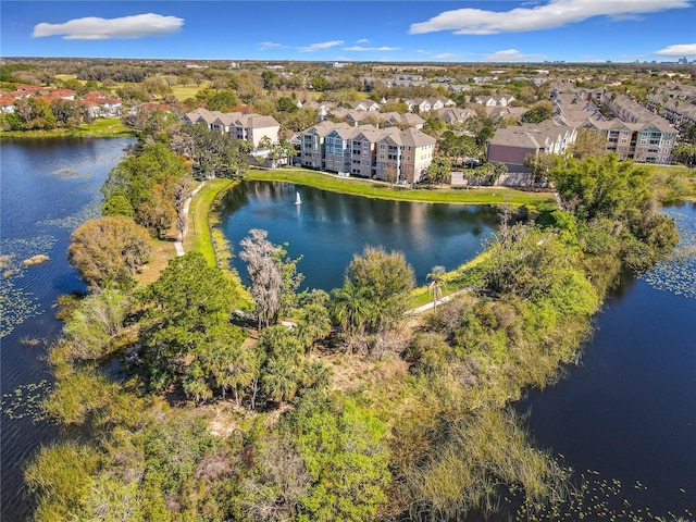 bird's eye view with a water view and a residential view