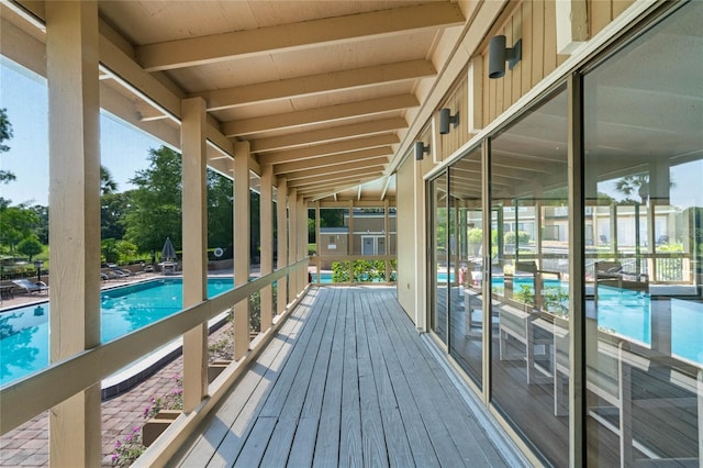 deck with a community pool