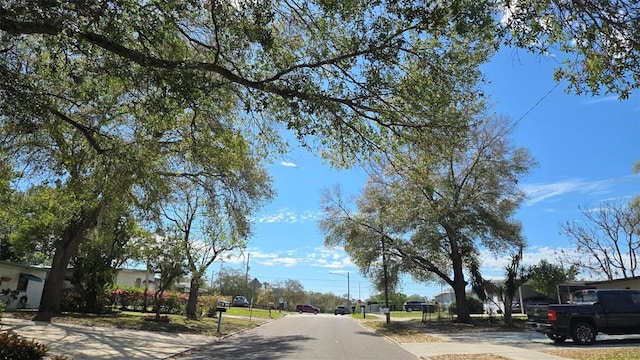 view of street with curbs and street lights