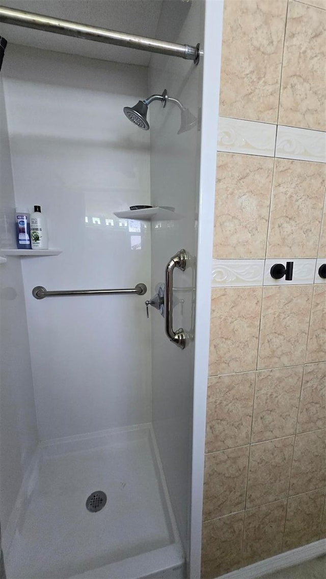 bathroom featuring a stall shower