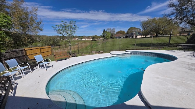 view of pool with a patio area, a fenced backyard, a fenced in pool, and a yard