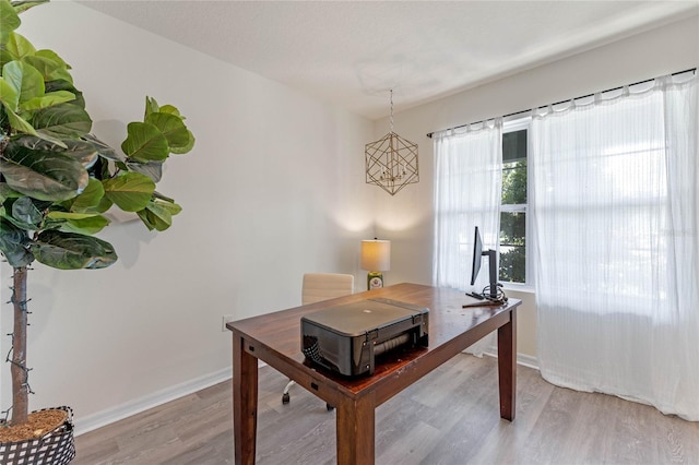 office with light wood finished floors and baseboards