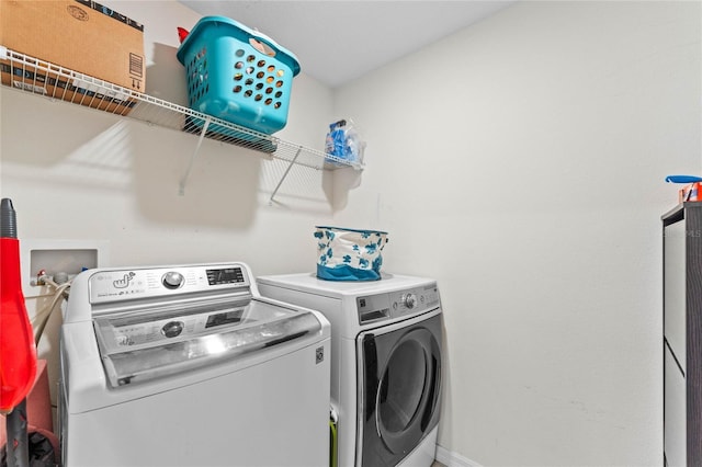 laundry area featuring laundry area and washer and clothes dryer