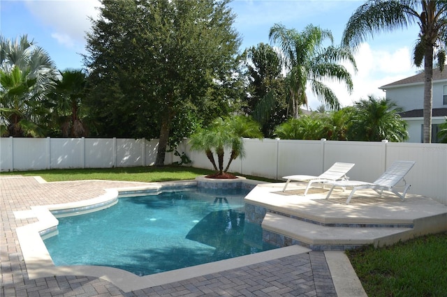 view of swimming pool with a patio area, a fenced backyard, and a fenced in pool