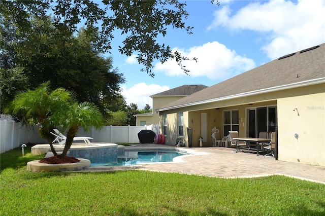 view of swimming pool with a fenced in pool, a fenced backyard, a yard, a patio area, and a diving board