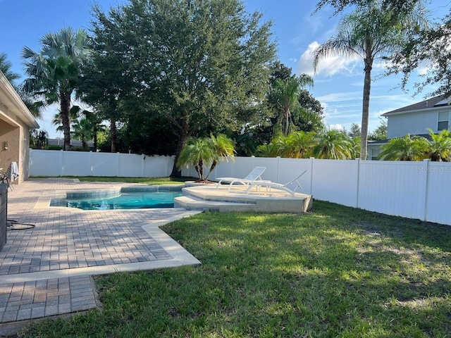 view of pool with a fenced in pool, a patio area, a yard, and a fenced backyard