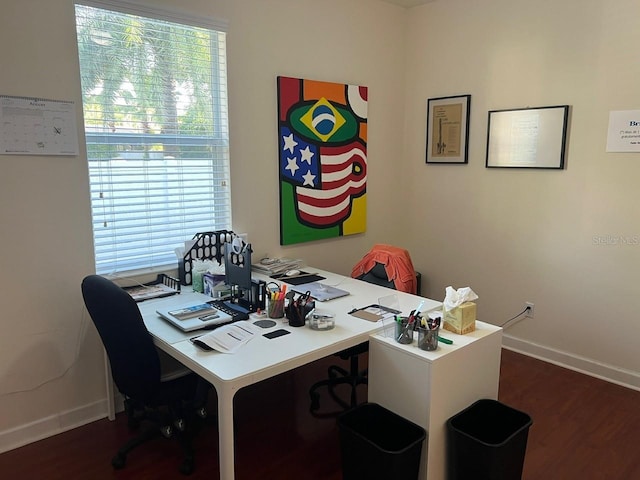 office area featuring baseboards and wood finished floors