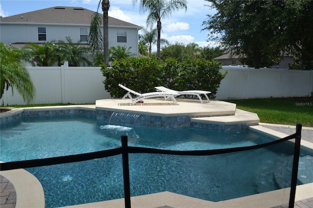 view of swimming pool featuring a patio area, fence, and a fenced in pool