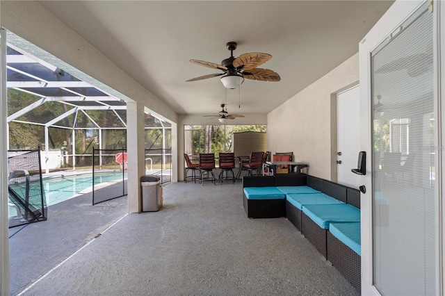 view of patio featuring a lanai, ceiling fan, an outdoor hangout area, and an outdoor pool