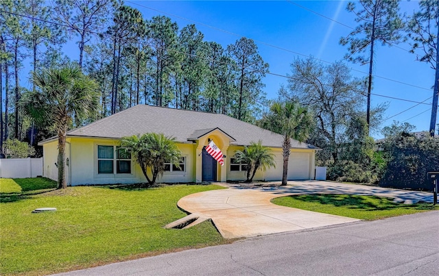 view of front of property with fence, an attached garage, stucco siding, a front lawn, and concrete driveway