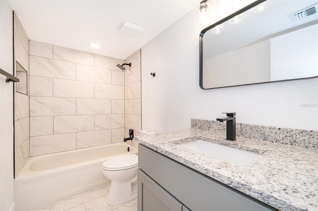 full bathroom featuring marble finish floor, visible vents, toilet, tub / shower combination, and vanity