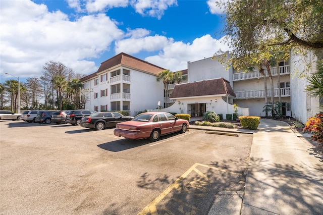 view of property with uncovered parking