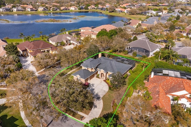 bird's eye view featuring a residential view and a water view