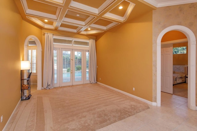 1704 Kersley Cir, Lake Mary, FL 32746 - carpeted spare room with baseboards, arched walkways, coffered ceiling, a towering ceiling, and crown molding