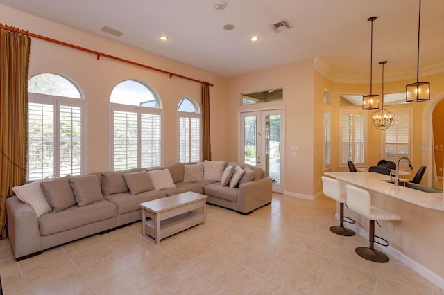 1704 Kersley Cir, Lake Mary, FL 32746 - living room with baseboards, plenty of natural light, visible vents, and an inviting chandelier