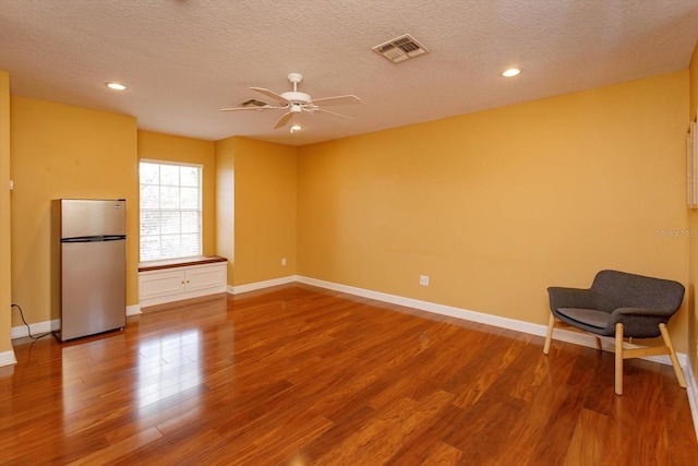 1704 Kersley Cir, Lake Mary, FL 32746 - unfurnished room with visible vents, a ceiling fan, a textured ceiling, wood finished floors, and baseboards