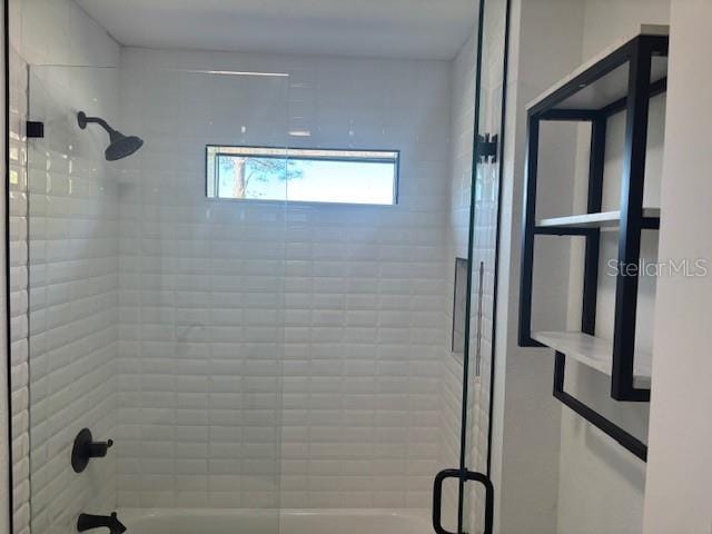 full bathroom with combined bath / shower with glass door