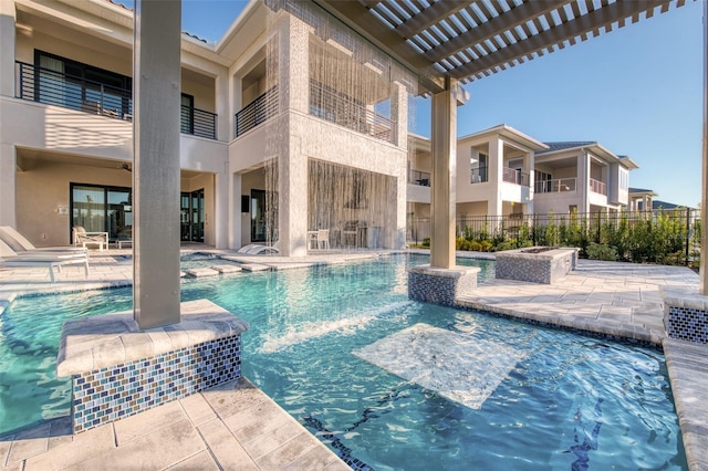 community pool featuring a pergola and a patio