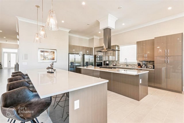 kitchen with island range hood, decorative backsplash, a spacious island, a kitchen breakfast bar, and stainless steel appliances