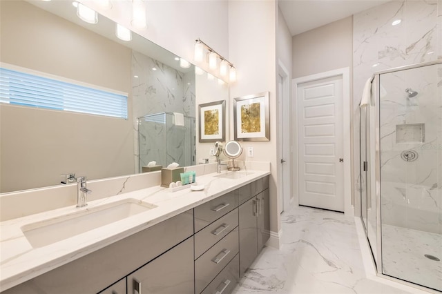 bathroom featuring marble finish floor, double vanity, a sink, and a marble finish shower