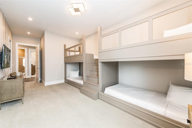 bedroom featuring light carpet, baseboards, and recessed lighting