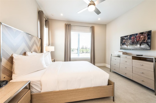 bedroom featuring recessed lighting, light colored carpet, ceiling fan, and baseboards