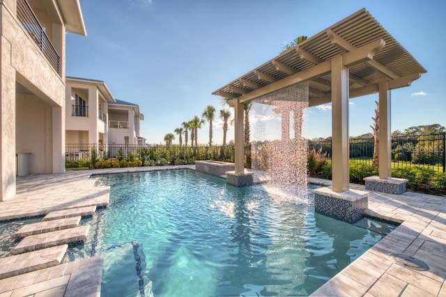 view of swimming pool featuring a patio area, fence, a fenced in pool, and a pergola