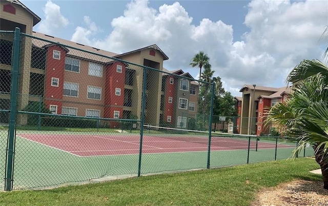 view of sport court with fence