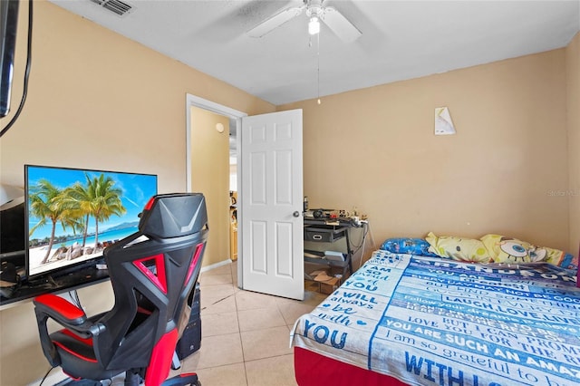 tiled bedroom with ceiling fan and visible vents