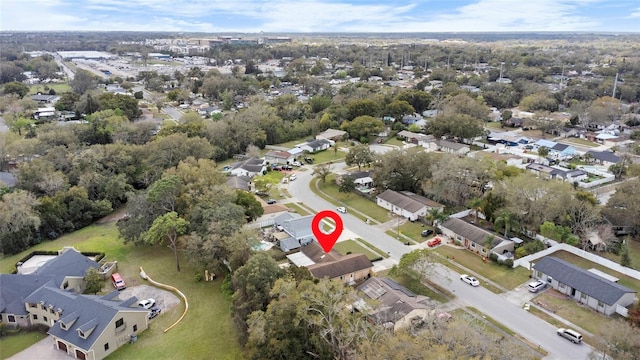 birds eye view of property with a residential view