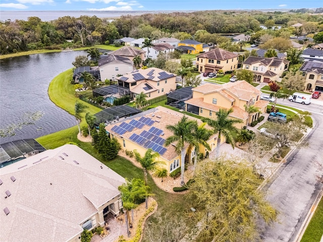 birds eye view of property featuring a residential view and a water view