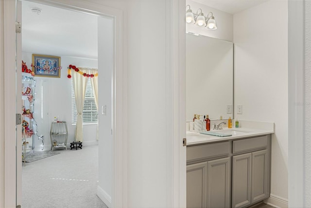 bathroom with baseboards and vanity