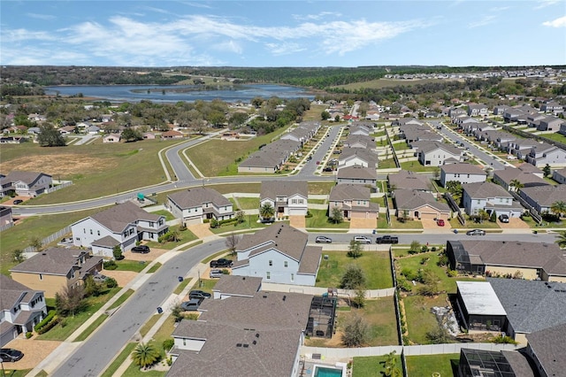 bird's eye view with a water view and a residential view