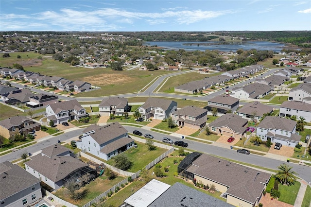 birds eye view of property with a residential view and a water view