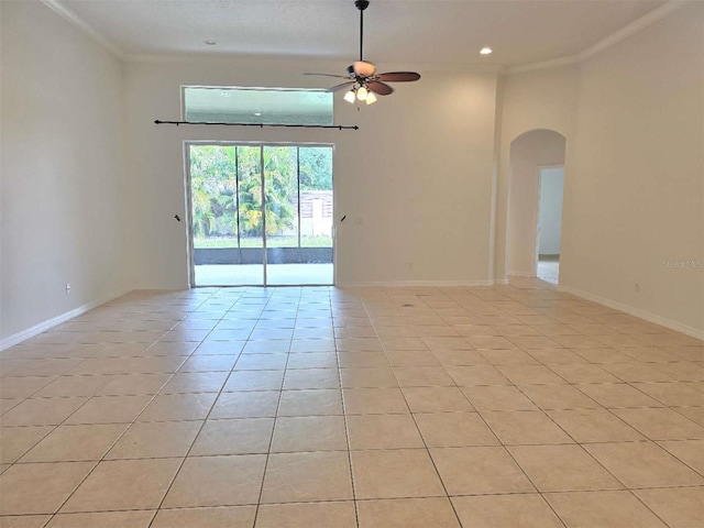 13413 Zori Ln, Windermere, FL 34786 - empty room with arched walkways, ceiling fan, light tile patterned flooring, crown molding, and recessed lighting