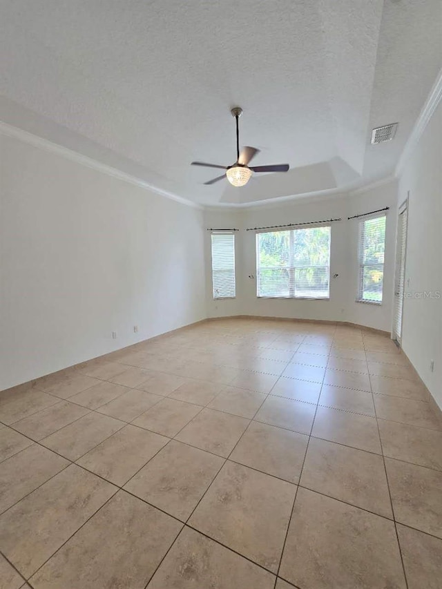 13413 Zori Ln, Windermere, FL 34786 - empty room featuring ornamental molding, a ceiling fan, light tile patterned flooring, a raised ceiling, and a textured ceiling