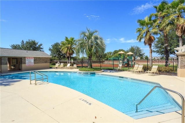 13413 Zori Ln, Windermere, FL 34786 - community pool featuring a patio