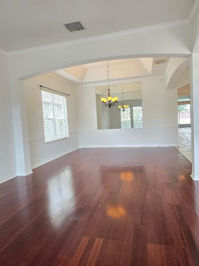 13413 Zori Ln, Windermere, FL 34786 - spare room with a chandelier, wood-type flooring, a raised ceiling, and ornamental molding