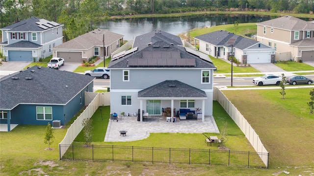 aerial view with a water view and a residential view