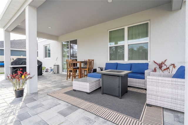 view of patio / terrace featuring a grill, an outdoor hangout area, and outdoor dining area