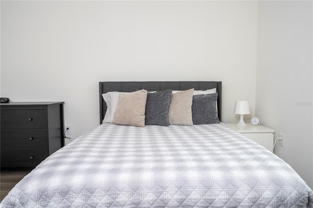 bedroom with wood finished floors