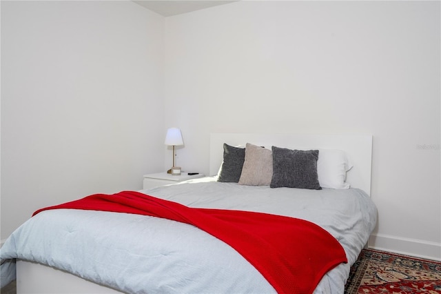 bedroom featuring baseboards