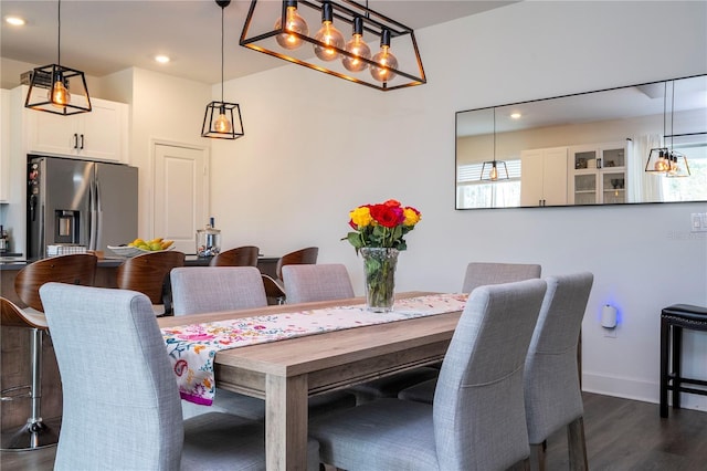 dining space with dark wood-style floors, recessed lighting, and baseboards