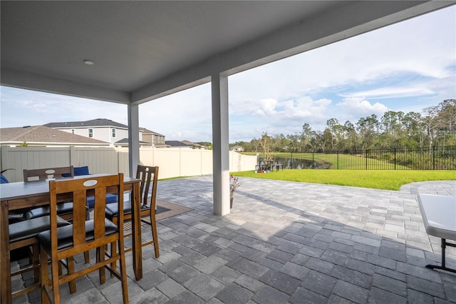 view of patio with outdoor dining space and a fenced backyard